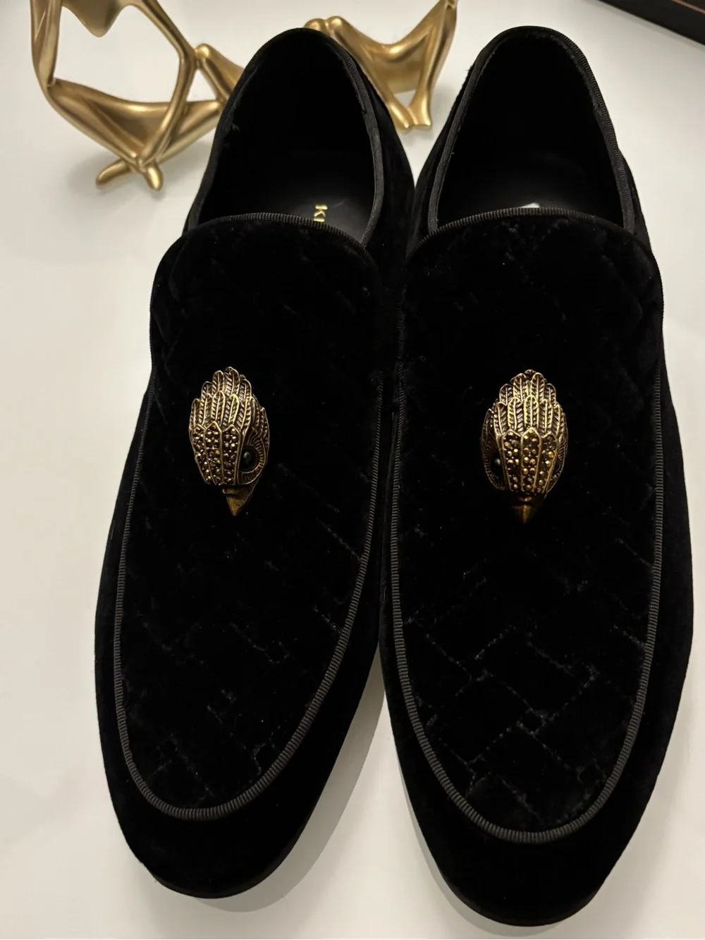 Kurt Geiger Black Velvet Slip-On Loafers with Ornate Gold Emblem